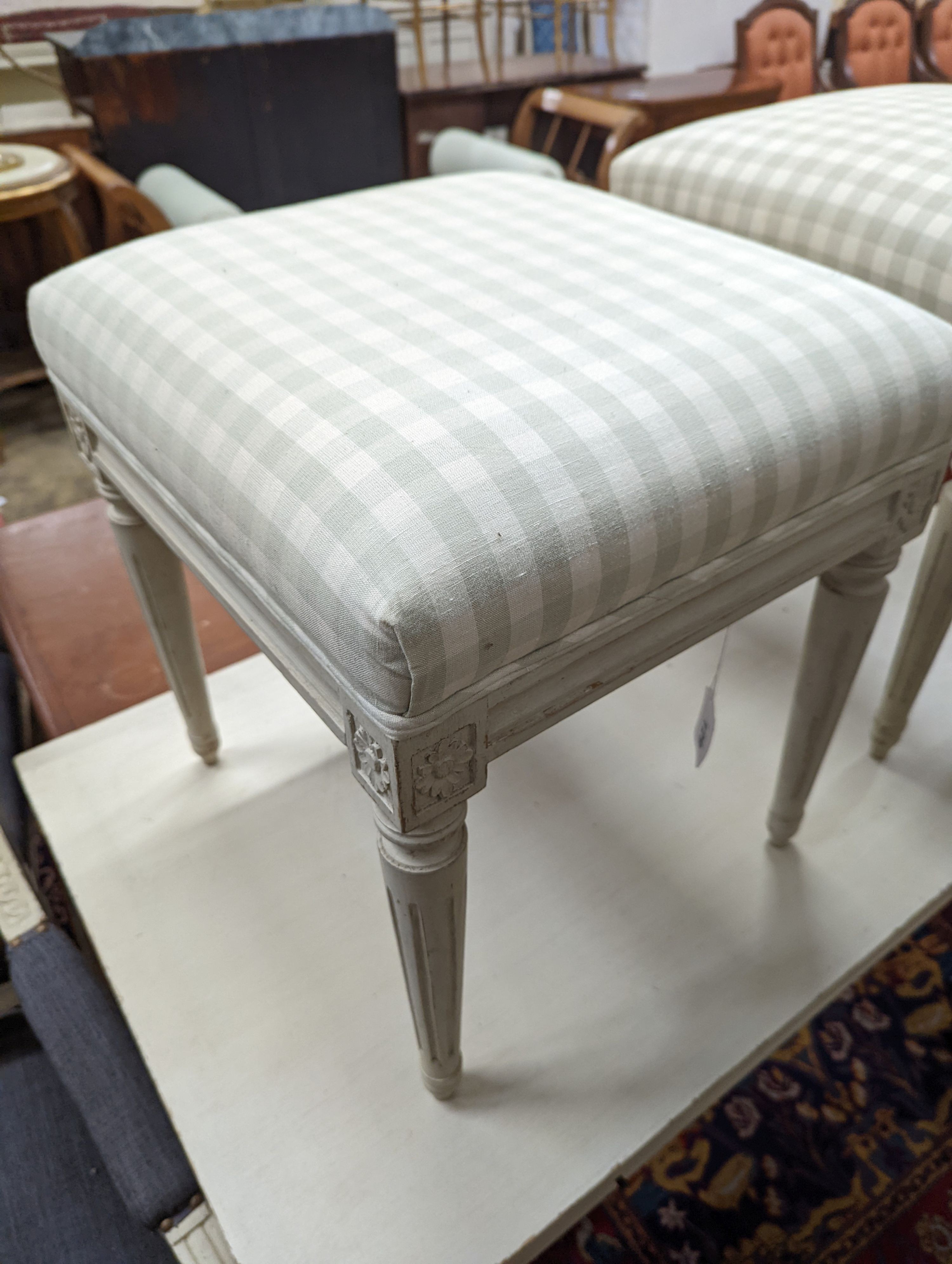 A rectangular painted dressing table, width 110cm, depth 60cm, height 75cm, together with two painted dressing stools